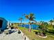 Relaxing view of a lake and lush greenery from a patio at 966 Jolanda Cir, Venice, FL 34285