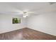 Bedroom with laminate flooring and ceiling fan at 97 Robina St, Port Charlotte, FL 33954