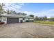 Attached garage with driveway, providing ample parking at 97 Robina St, Port Charlotte, FL 33954