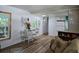 Bright dining area with white table and chairs near the kitchen at 113 Ravenna N St, Nokomis, FL 34275