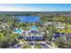 Community clubhouse, pool, playground, lake, and ample parking at 11897 Hunters Creek Rd, Venice, FL 34293