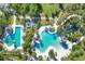 An aerial view showcasing the community pool, waterslide, lap pool, and surrounding amenities at 11897 Hunters Creek Rd, Venice, FL 34293