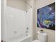 Clean and bright bathroom with white tile and modern fixtures at 11897 Hunters Creek Rd, Venice, FL 34293