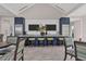 Clubhouse kitchen with bar seating, modern appliances, and sleek countertops at 11897 Hunters Creek Rd, Venice, FL 34293