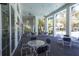 Covered patio area with seating and a view of the community pool at 11897 Hunters Creek Rd, Venice, FL 34293