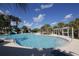 Inviting community pool with a waterslide, perfect for cooling off on a sunny day at 11897 Hunters Creek Rd, Venice, FL 34293