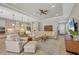 Open-concept living room and kitchen with modern finishes at 11897 Hunters Creek Rd, Venice, FL 34293