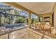 Screened lanai with pool, spa and seating area at 11897 Hunters Creek Rd, Venice, FL 34293