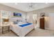 Main bedroom with king-size bed and ensuite bathroom at 12115 Stuart Dr, Venice, FL 34293