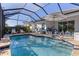 Large screened pool with plenty of seating at 12115 Stuart Dr, Venice, FL 34293