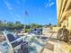 Spacious patio overlooking the water with comfortable seating at 124 Villa Dr # 124, Osprey, FL 34229