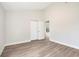 Spacious bedroom with neutral walls and wood-look flooring at 1255 Gantry Rd, North Port, FL 34288