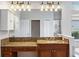 Bathroom with granite vanity and large mirror at 134 Savona Way, North Venice, FL 34275