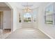 Bright dining room featuring a large arched window at 134 Savona Way, North Venice, FL 34275