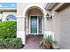 Elegant entryway with arched doorway and brick walkway at 134 Savona Way, North Venice, FL 34275