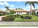 Well-maintained house with attractive landscaping and a paved driveway at 134 Savona Way, North Venice, FL 34275