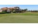 Golf course with clubhouse in the background at 134 Savona Way, North Venice, FL 34275