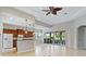 Spacious kitchen with island, granite countertops, and stainless steel appliances at 134 Savona Way, North Venice, FL 34275