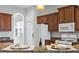 Spacious kitchen with granite countertops and wood cabinets at 134 Savona Way, North Venice, FL 34275