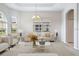 Living room with staged furniture and a neutral color scheme at 134 Savona Way, North Venice, FL 34275