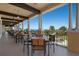 Outdoor patio with tables and chairs overlooking golf course at 134 Savona Way, North Venice, FL 34275