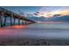 Long pier extending into ocean at sunset at 134 Savona Way, North Venice, FL 34275