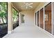 Spacious screened porch with ceiling fan and access to backyard at 134 Savona Way, North Venice, FL 34275