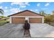 Front view of a two-car garage at 1709 Curry Ave # 83, Nokomis, FL 34275