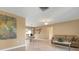 Living room with tiled floor, neutral walls, and comfortable seating at 1745 S Gondola Ct, Venice, FL 34293