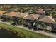 Aerial view showcasing multiple homes with pools and canal-side access at 19267 Kirella St, Venice, FL 34293