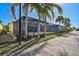 Screened patio with seating area and lush landscaping at 19267 Kirella St, Venice, FL 34293