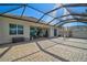 Large screened patio with pavers and lake view at 19267 Kirella St, Venice, FL 34293