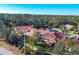 Aerial view of a community with houses and lush greenery at 19348 Yellowtail Ct, Venice, FL 34292