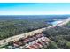 Aerial view of houses near a highway and forest at 19348 Yellowtail Ct, Venice, FL 34292