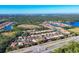 Aerial view of houses and landscape, roads and lake at 19348 Yellowtail Ct, Venice, FL 34292