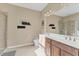 Double vanity bathroom with large shower and tile flooring at 19348 Yellowtail Ct, Venice, FL 34292