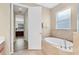 Bathroom features a garden tub and separate shower at 19348 Yellowtail Ct, Venice, FL 34292