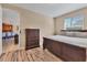 King-size bed in this bedroom with a view of kitchen at 19348 Yellowtail Ct, Venice, FL 34292