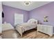 Light and airy bedroom with a double bed, dresser, and window coverings at 19348 Yellowtail Ct, Venice, FL 34292