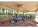 Covered patio with seating and fans at 19348 Yellowtail Ct, Venice, FL 34292