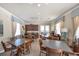 Community room with tables, chairs, and a kitchenette at 19348 Yellowtail Ct, Venice, FL 34292