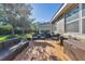 Spacious deck with wicker furniture and a view of the backyard at 19348 Yellowtail Ct, Venice, FL 34292