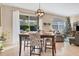 Bright dining area with sliding glass doors leading to the backyard at 19348 Yellowtail Ct, Venice, FL 34292