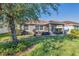 Single-story house with a covered patio and manicured lawn at 19348 Yellowtail Ct, Venice, FL 34292