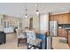 Island kitchen with stainless steel appliances and wood cabinets at 19348 Yellowtail Ct, Venice, FL 34292