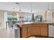 Island kitchen features granite countertops, stainless steel appliances, and ample cabinet space at 19348 Yellowtail Ct, Venice, FL 34292