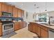 Updated kitchen with stainless steel appliances and a large island at 19348 Yellowtail Ct, Venice, FL 34292