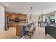 Modern kitchen with an island, stainless steel appliances, and wood cabinets at 19348 Yellowtail Ct, Venice, FL 34292