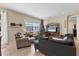 Bright and airy living room featuring a cozy seating arrangement at 19348 Yellowtail Ct, Venice, FL 34292