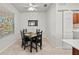 Bright dining room with table and four chairs, featuring a large window at 19397 Rizzuto St, Venice, FL 34293